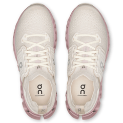 White and pink athletic shoes with visible brand logo on a white background