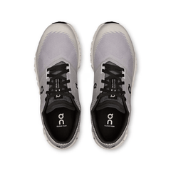 Gray running shoes with black soles on a white background