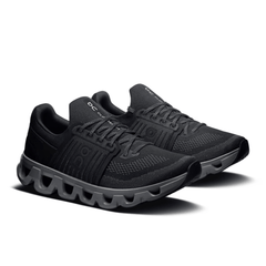 Black running shoes with unique sole design on a white background