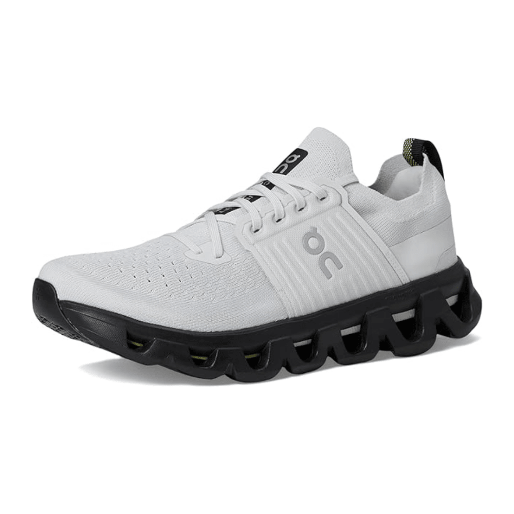 White running shoe with black sole on a white background