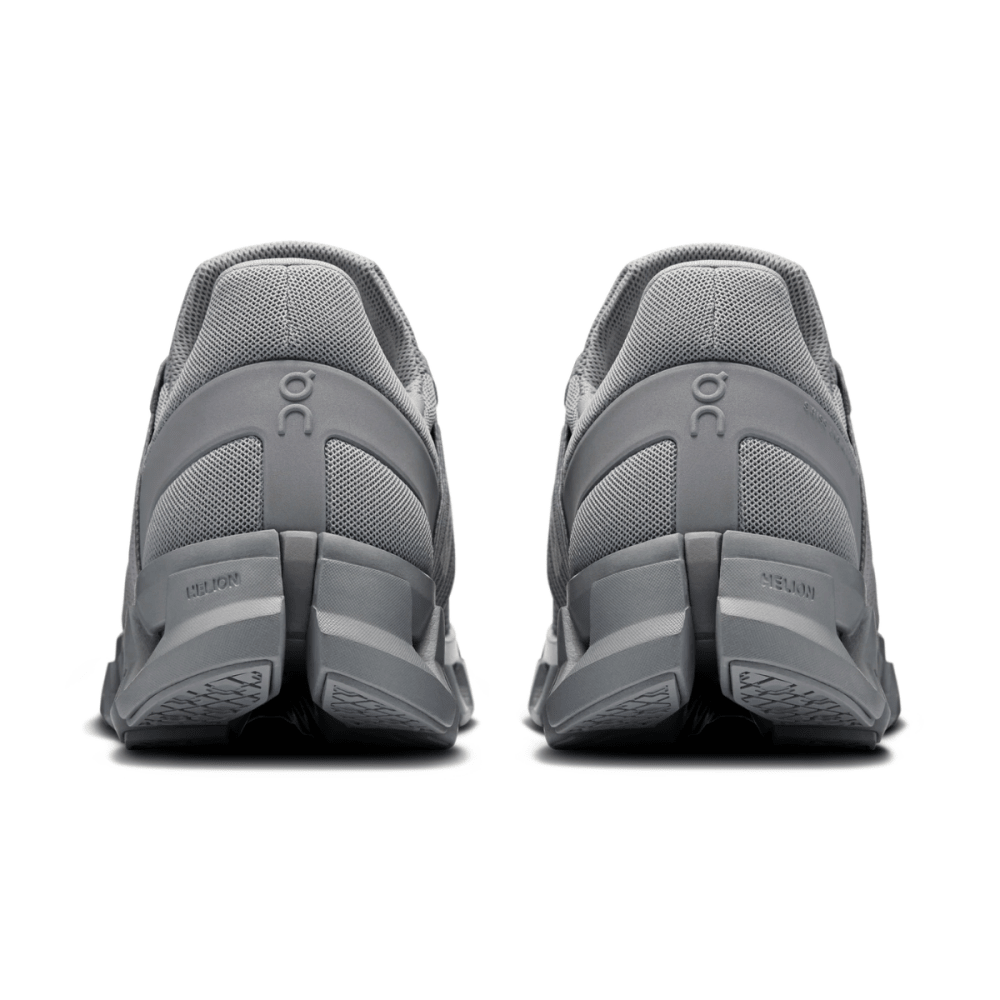Gray athletic shoes with 'On' branding on a white background