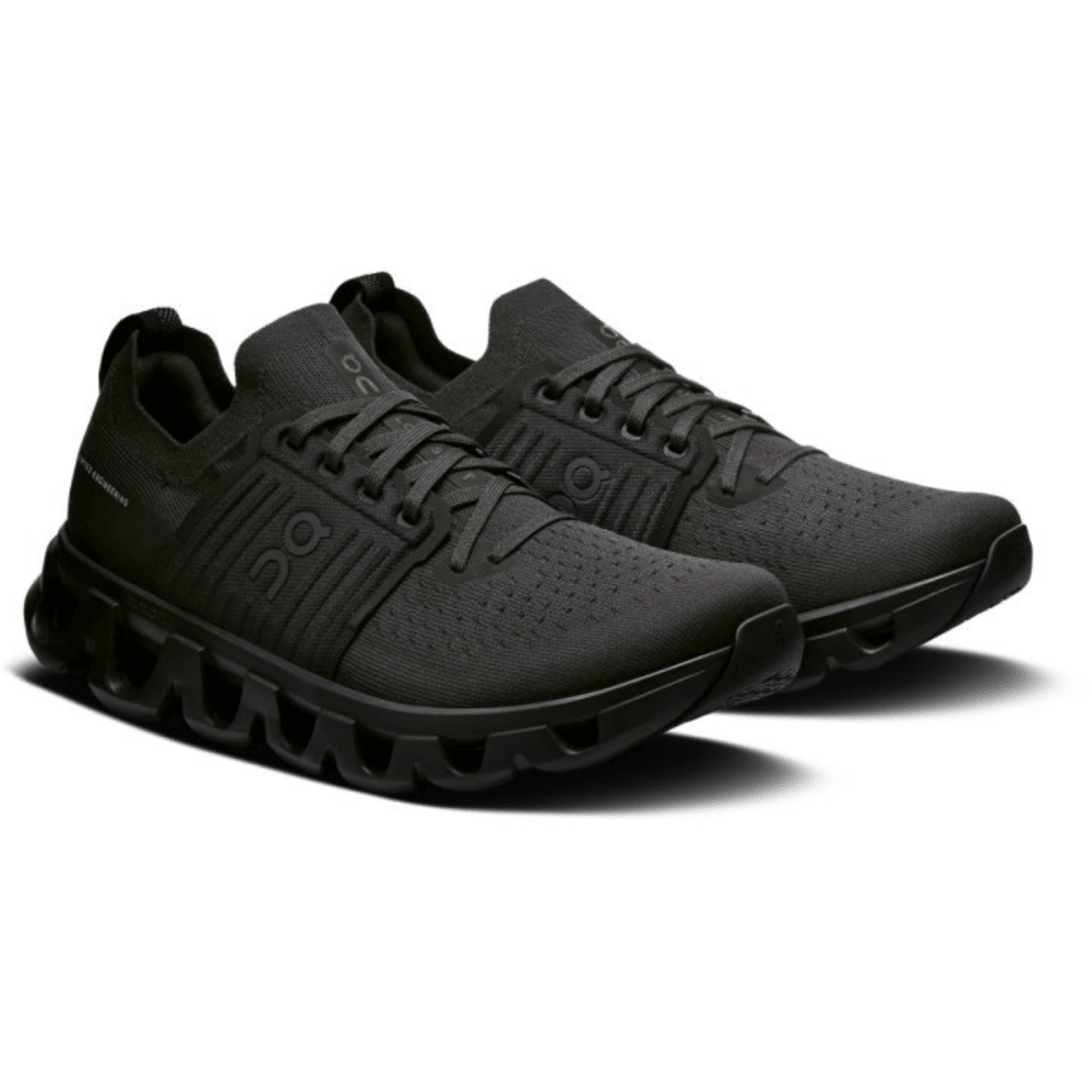 Black running shoes with a visible brand logo on a white background