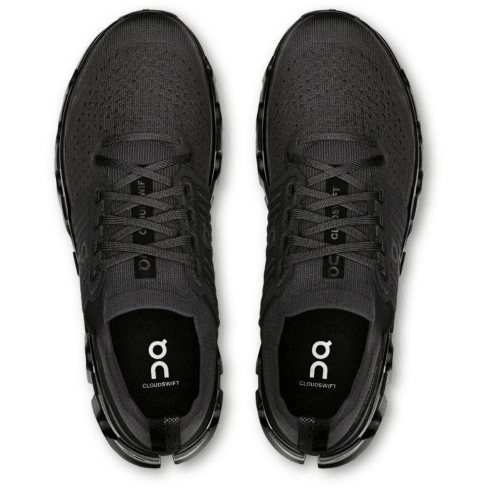 Black running shoes with 'on' logo on a white background
