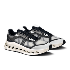 Front view of black and ivory On Cloudtilt Remix shoes