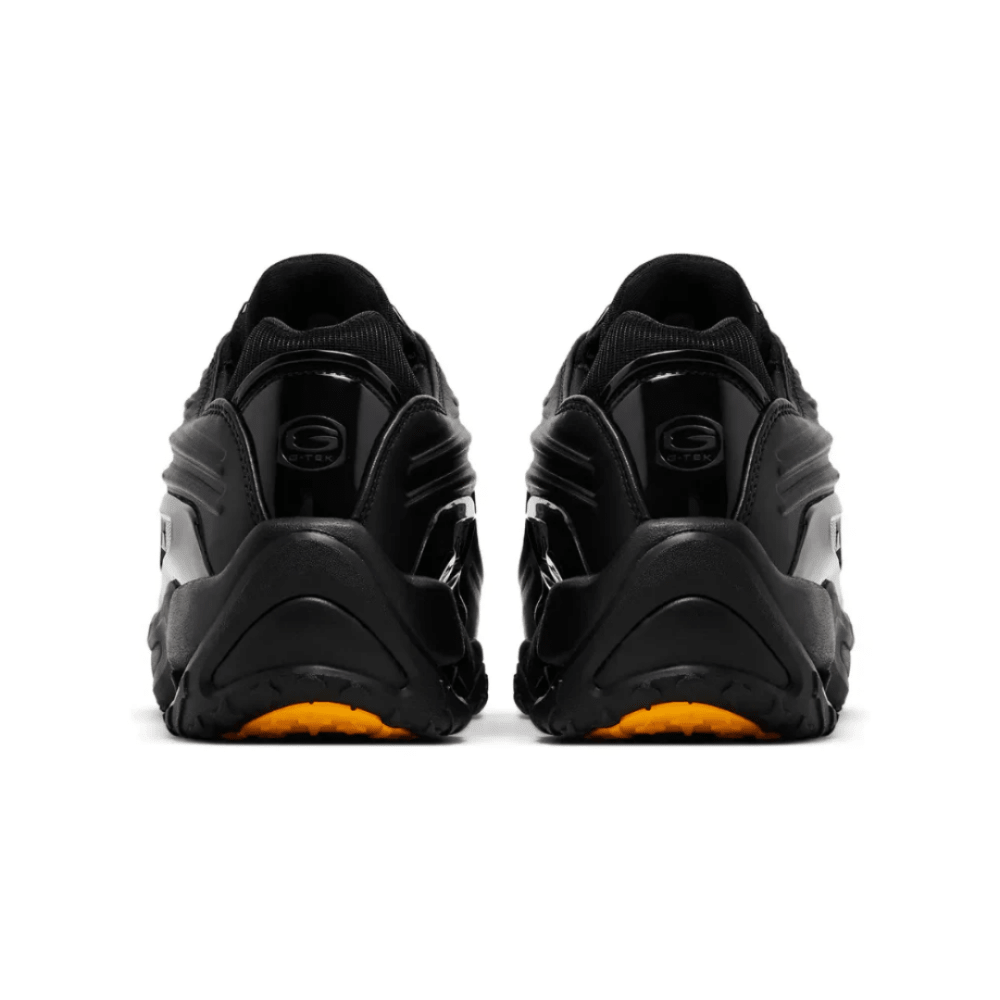 Front angle of Nike Nocta x Hot Step 2 'Black' with metallic lace eyelets