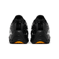 Front angle of Nike Nocta x Hot Step 2 'Black' with metallic lace eyelets