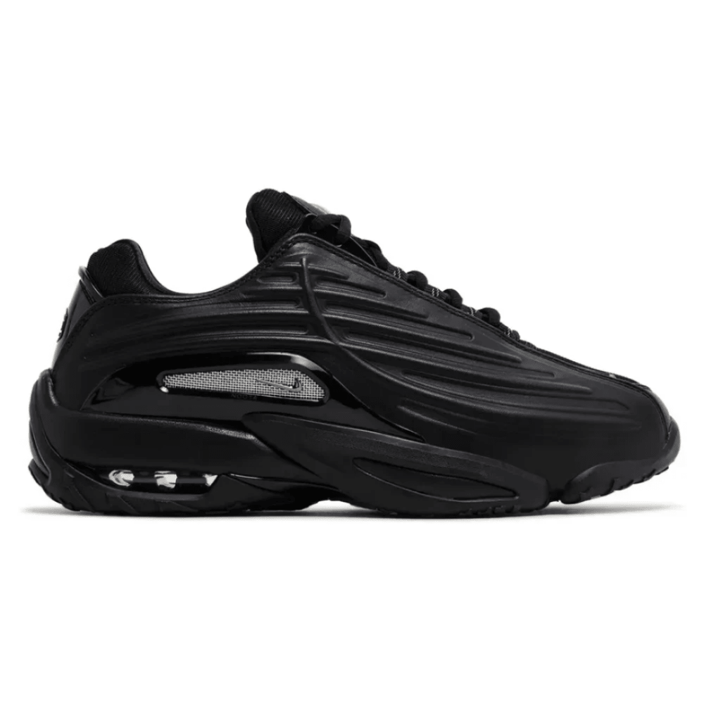 Side view of Nike Nocta x Hot Step 2 'Black' sneaker with layered black panels
